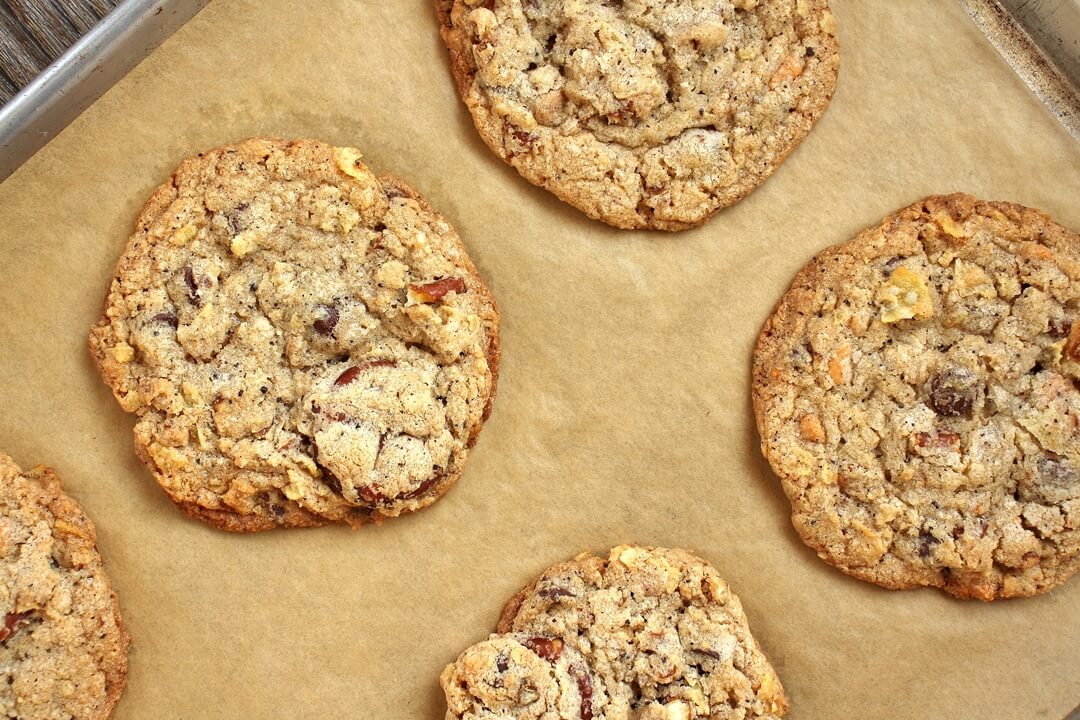 compost cookies on a parchment paper lined baking sheet