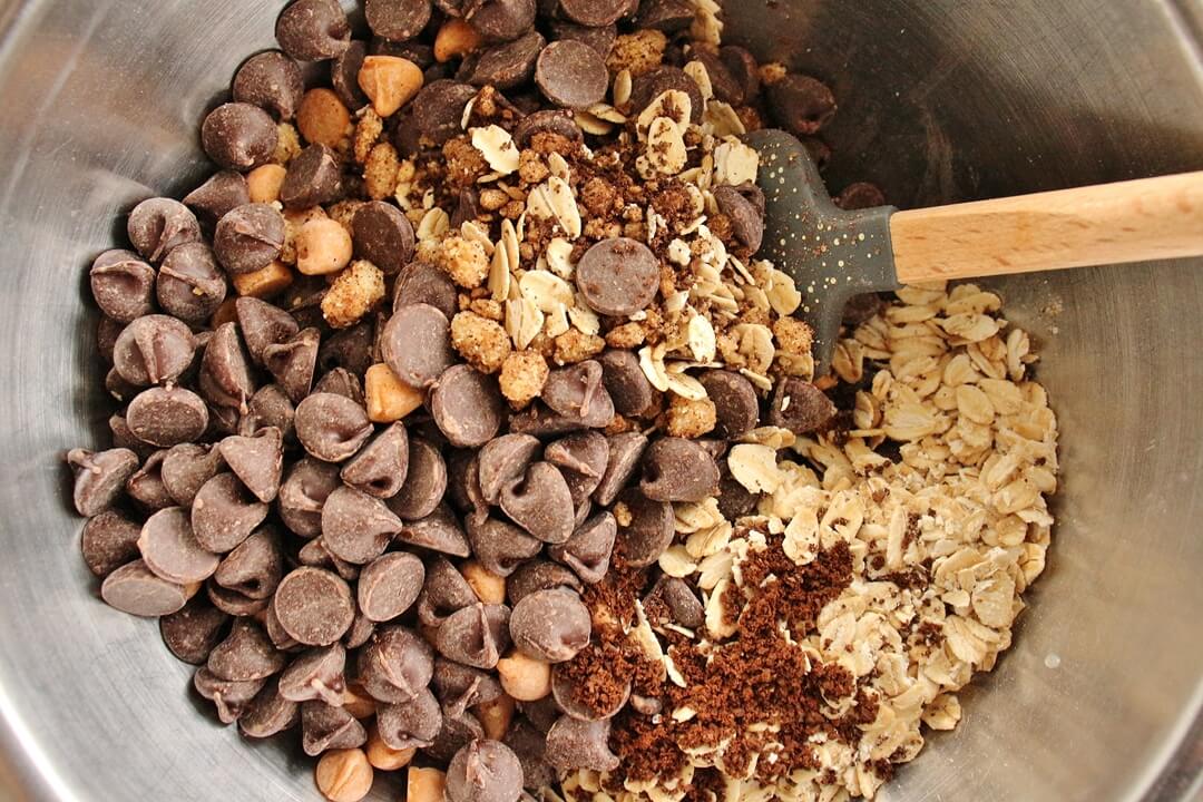 mix-ins for compost cookies in a metal mixing bowl