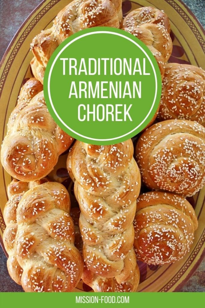 A platter of chorek (Armenian sweet bread) with a combination of braids and snail shapes, all topped with sesame seeds