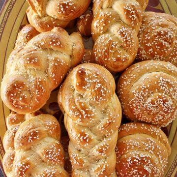 a large platter of Armenian chorek sweet bread with sesame seeds