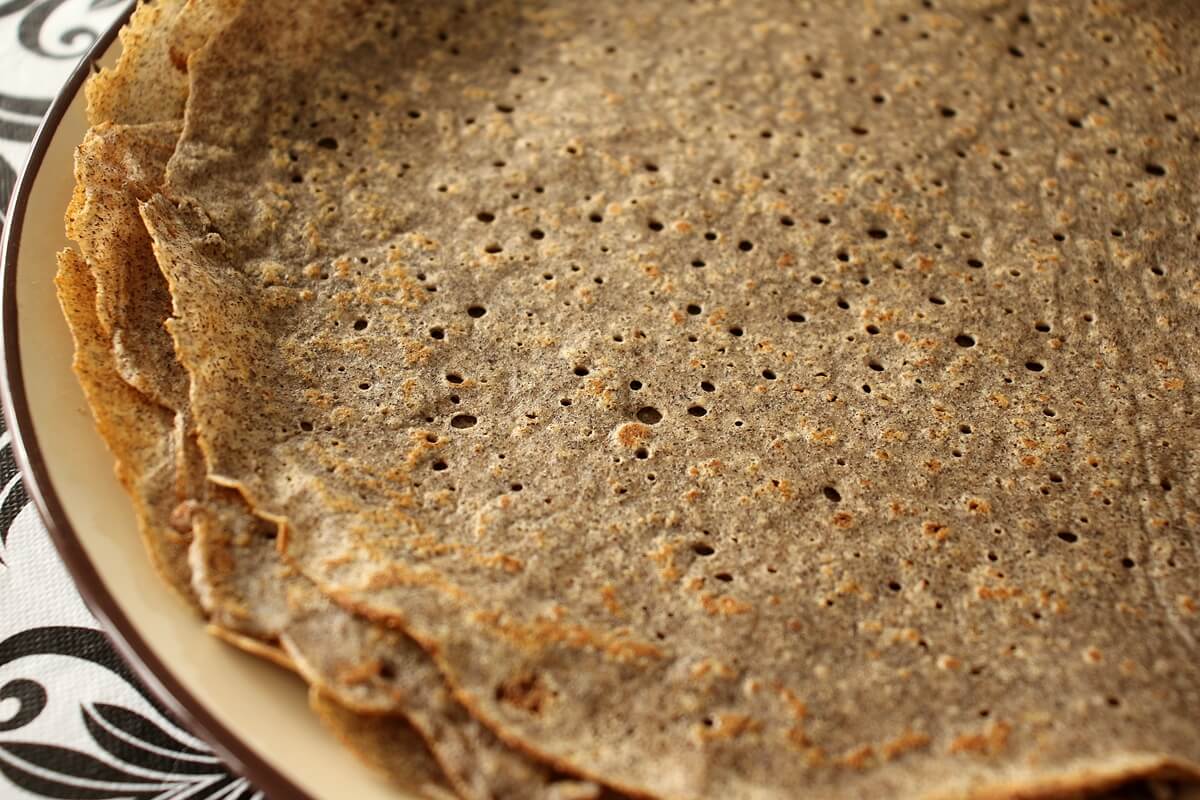 Stack of buckwheat galettes on a plate