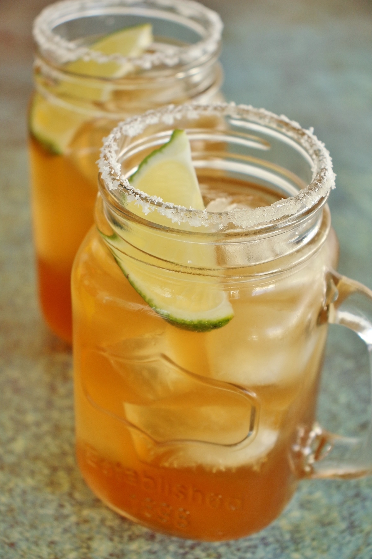 2 tamarind margaritas in mason jar mugs