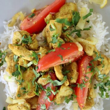 home-style chicken kebat stir-fry served on a square plate with rice