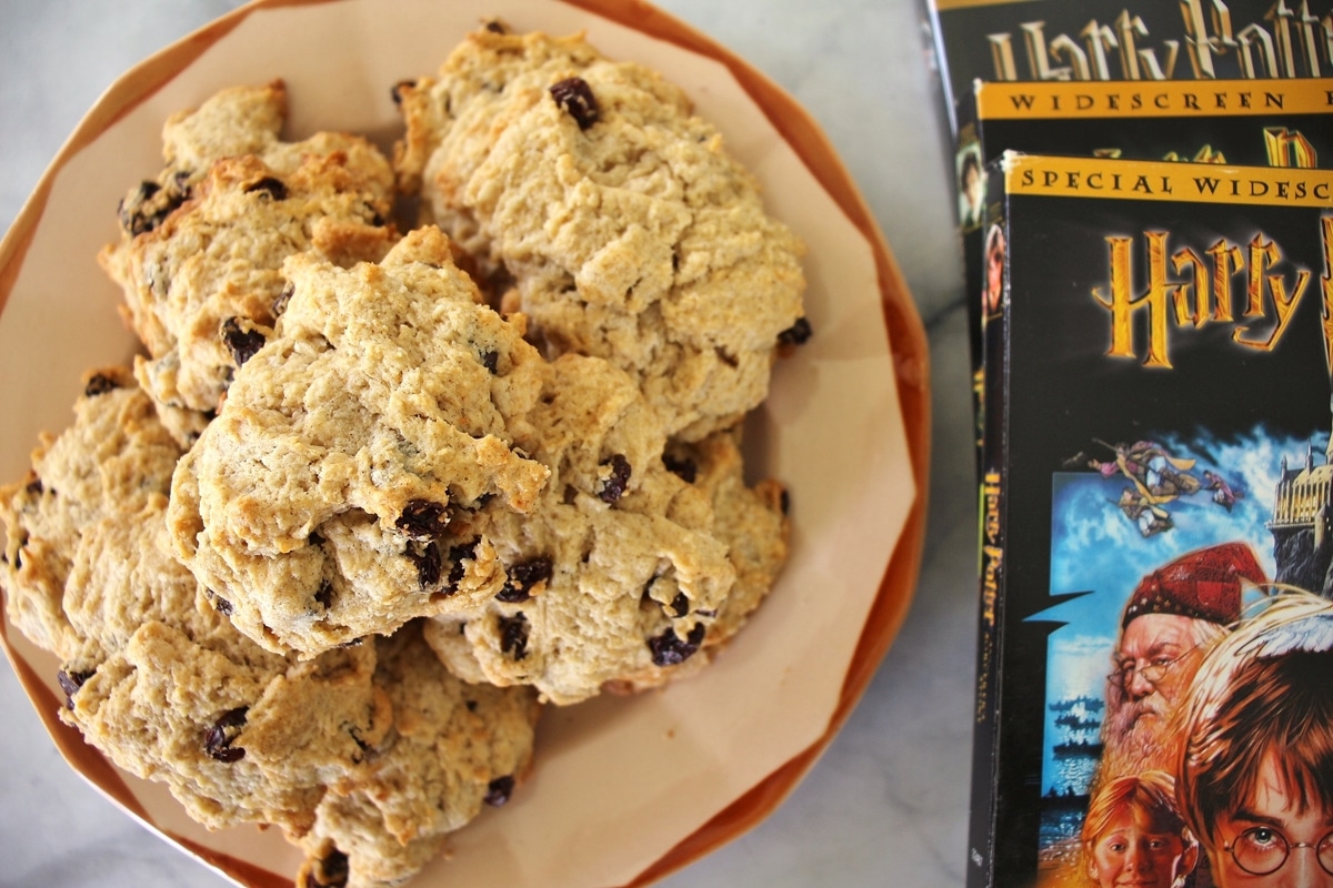 Antique plate topped with rock cakes, Harry Potter DVDs are arranged next to it