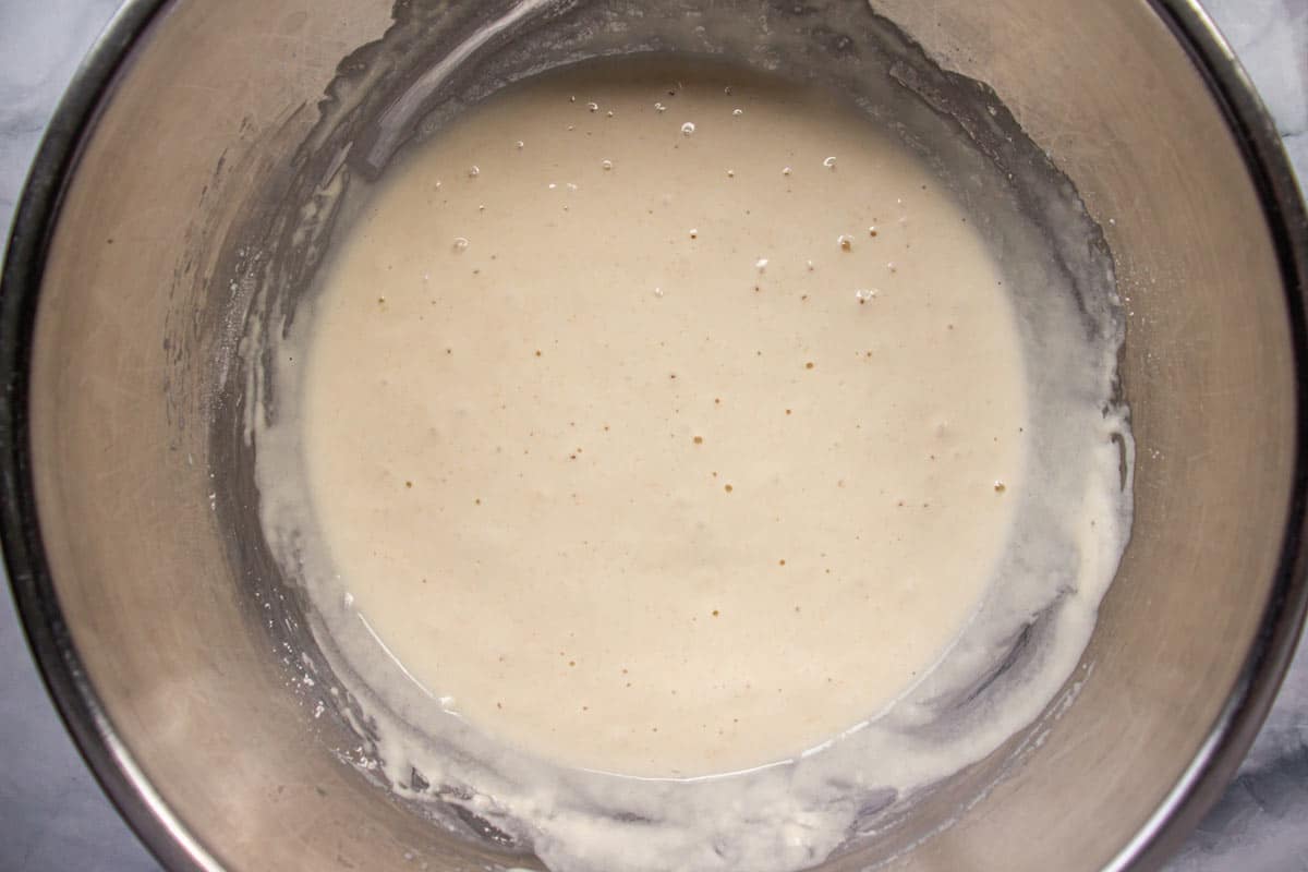 Thick white batter in a metal mixing bowl.