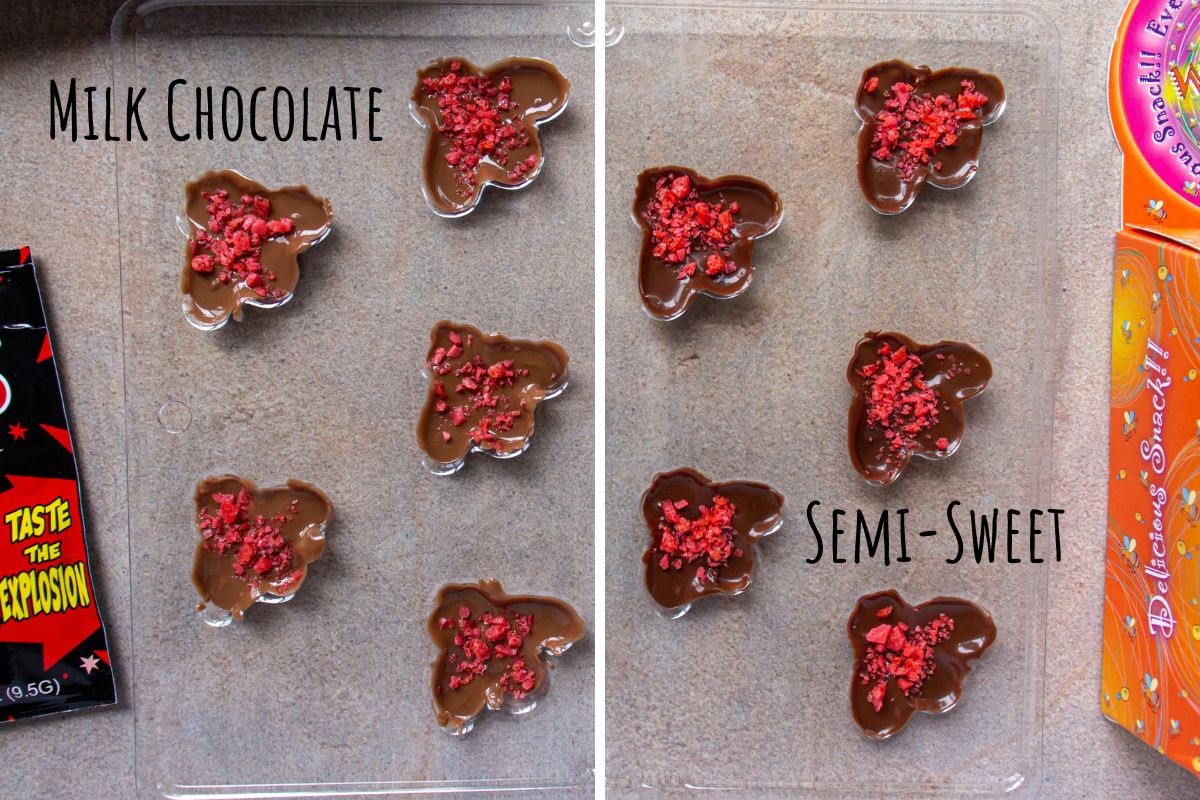 Melted chocolate in bee shaped candy molds topped with red popping candy.