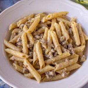 A shallow bowl of creamy Pasta alla Norcina with sausage.