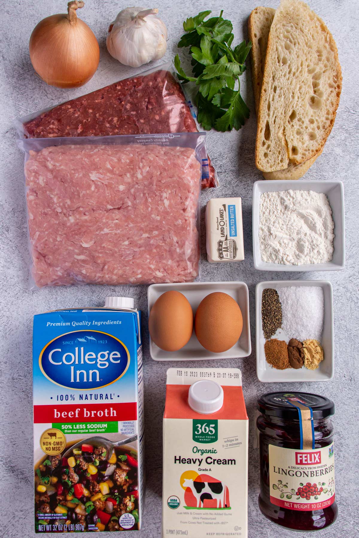 Ingredients for Swedish meatballs on a light grey background.