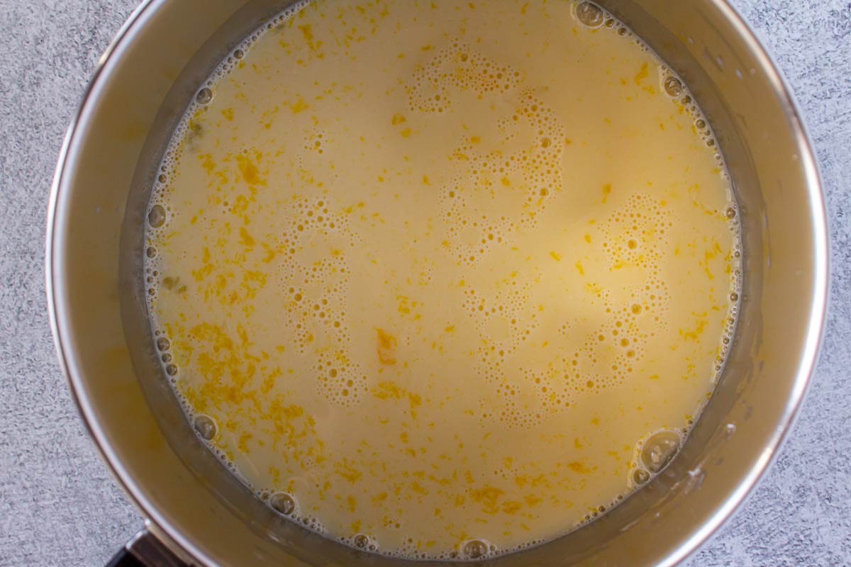 Milk, egg yolks, sugar, and cornstarch whisked together in a saucepan.