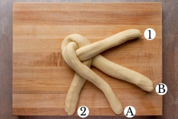 The third step in braiding a loaf of Swiss zopf bread.