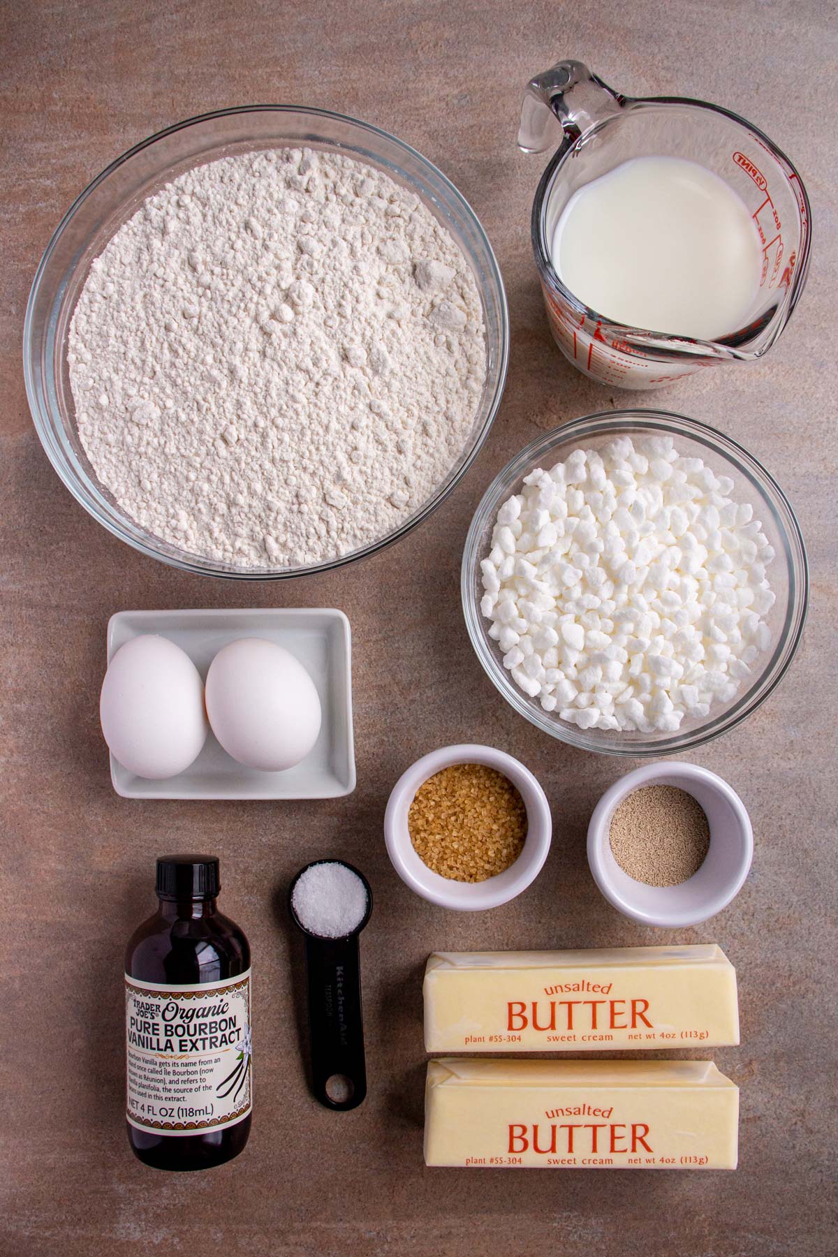 Ingredients for Belgian Liege waffles on a beige background.
