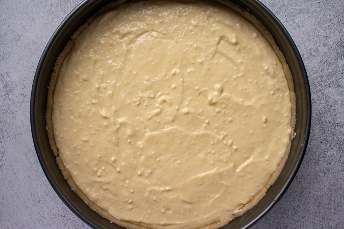 Unbaked German cheesecake in a springform pan.