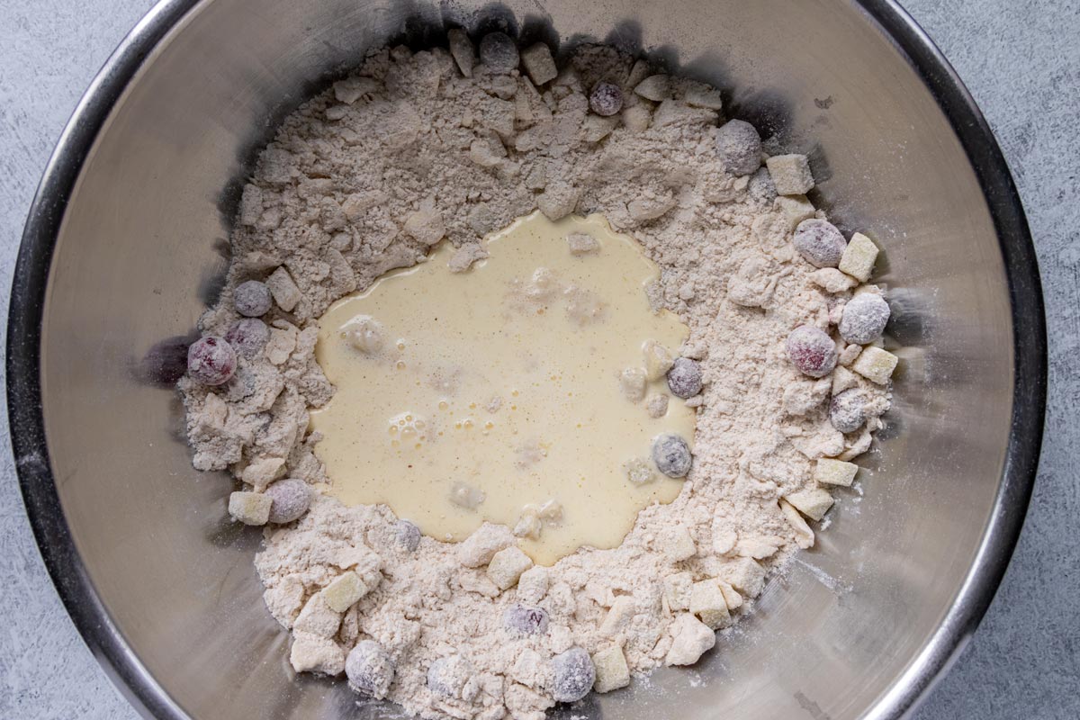 A flour mixture with a well in the middle filled with cream and beaten egg.