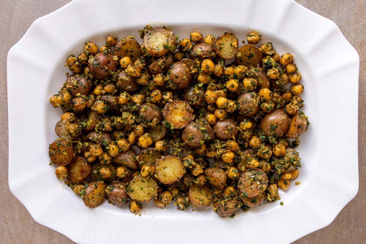 Aloo chaat in an oval serving dish without garnishes.