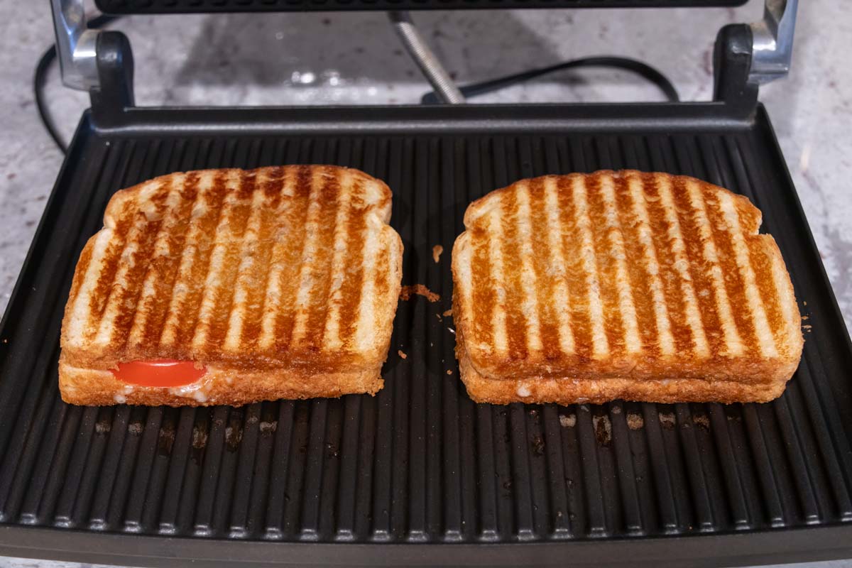 Two sandwiches after cooking in a panini maker.