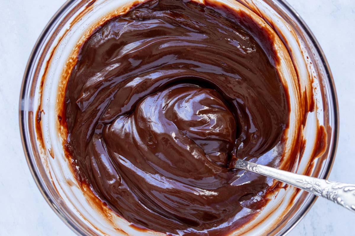 Smooth chocolate ganache after mixing in cubes of butter and whiskey.