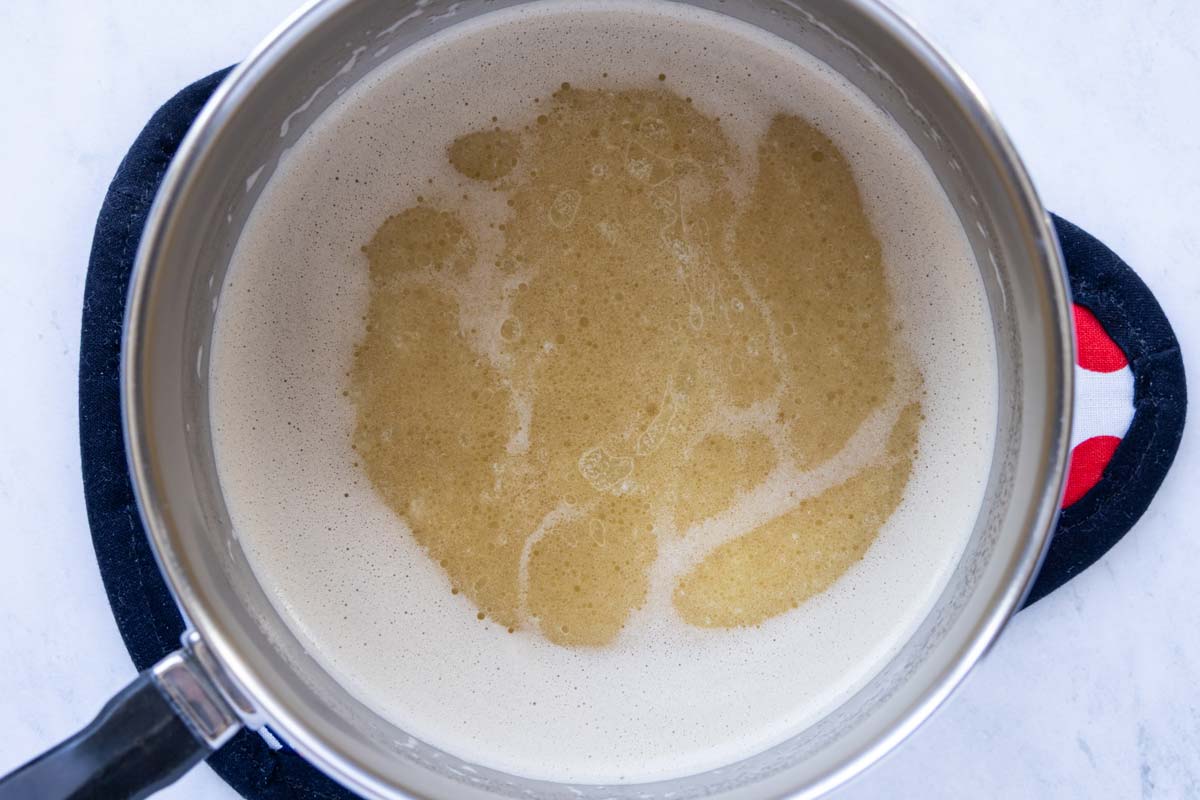 Guinness and butter in a small saucepan after heating to a simmer.