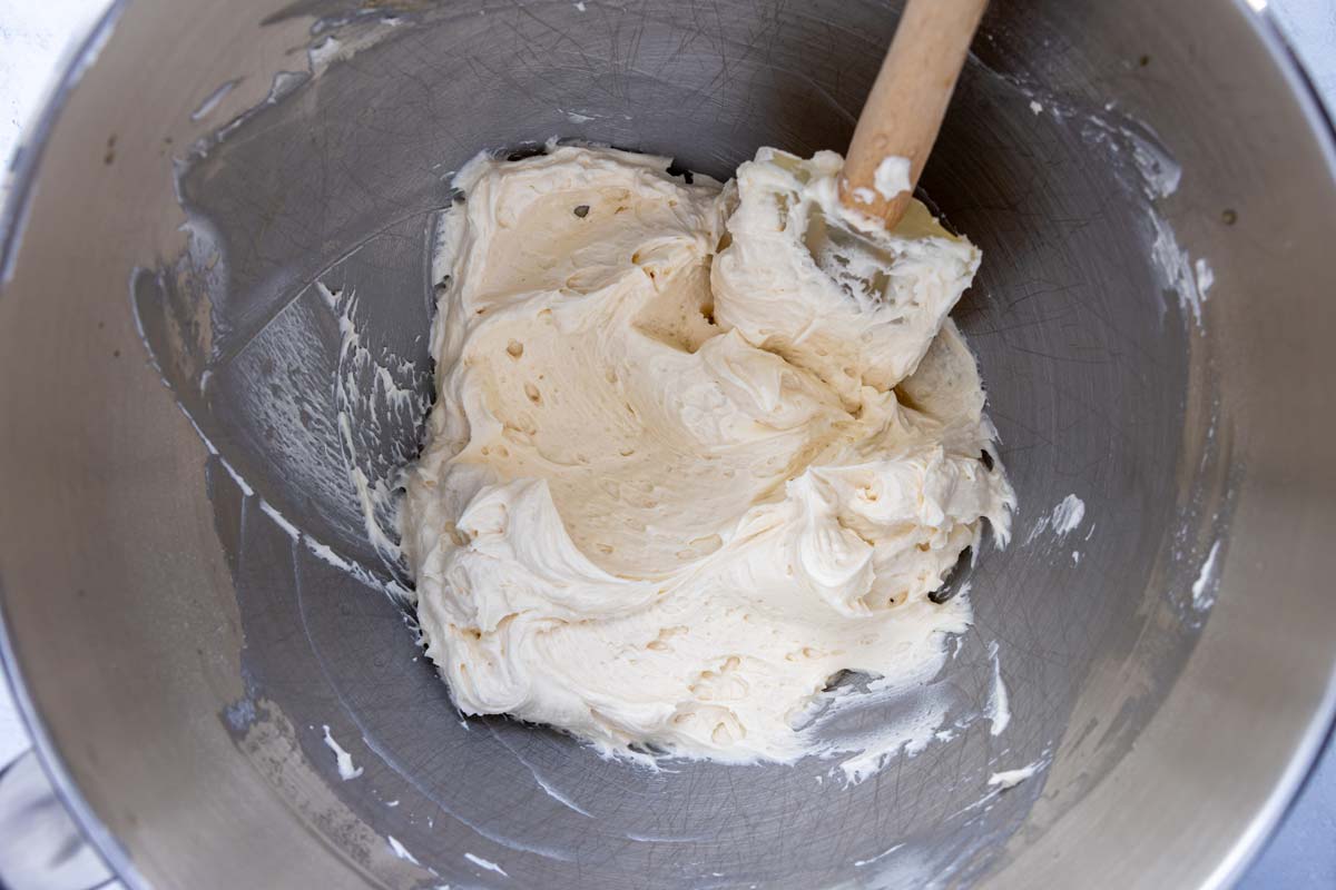 Bailey's frosting beaten until smooth in a metal mixing bowl.
