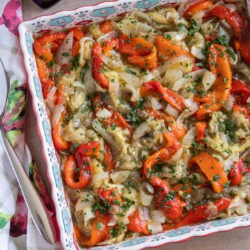 Catalan roasted vegetables (escalivada) served in a colorful square dish.
