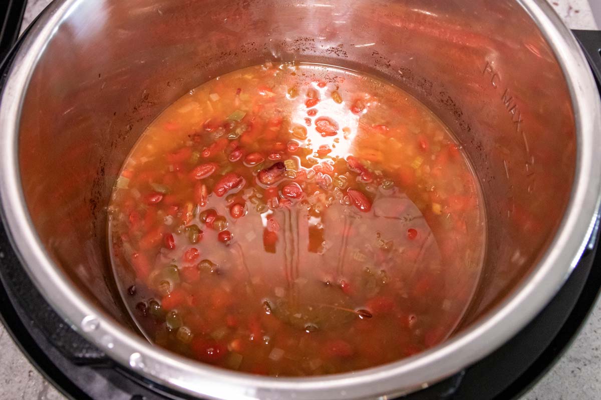 The contents of an Instant Pot making red beans and rice after removing the lid.