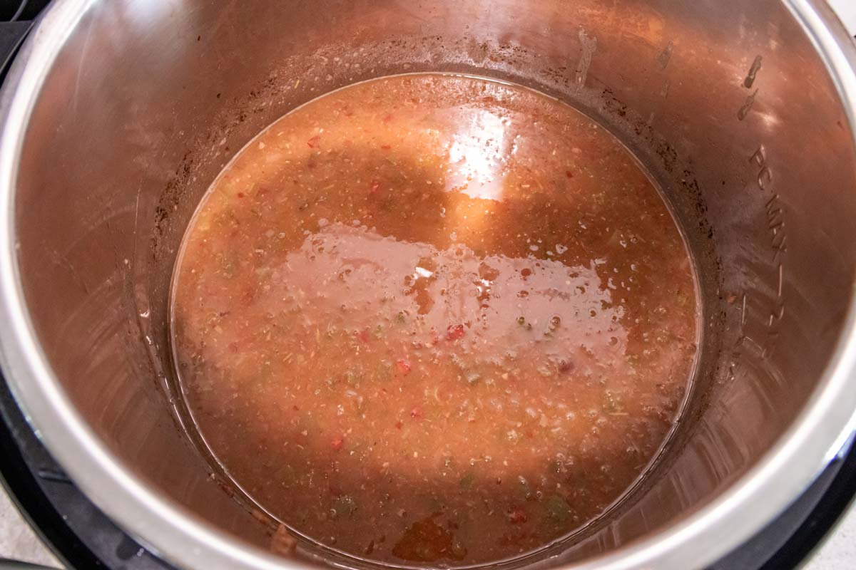 The contents of an Instant Pot after slightly pureeing the mixture inside to thicken it.