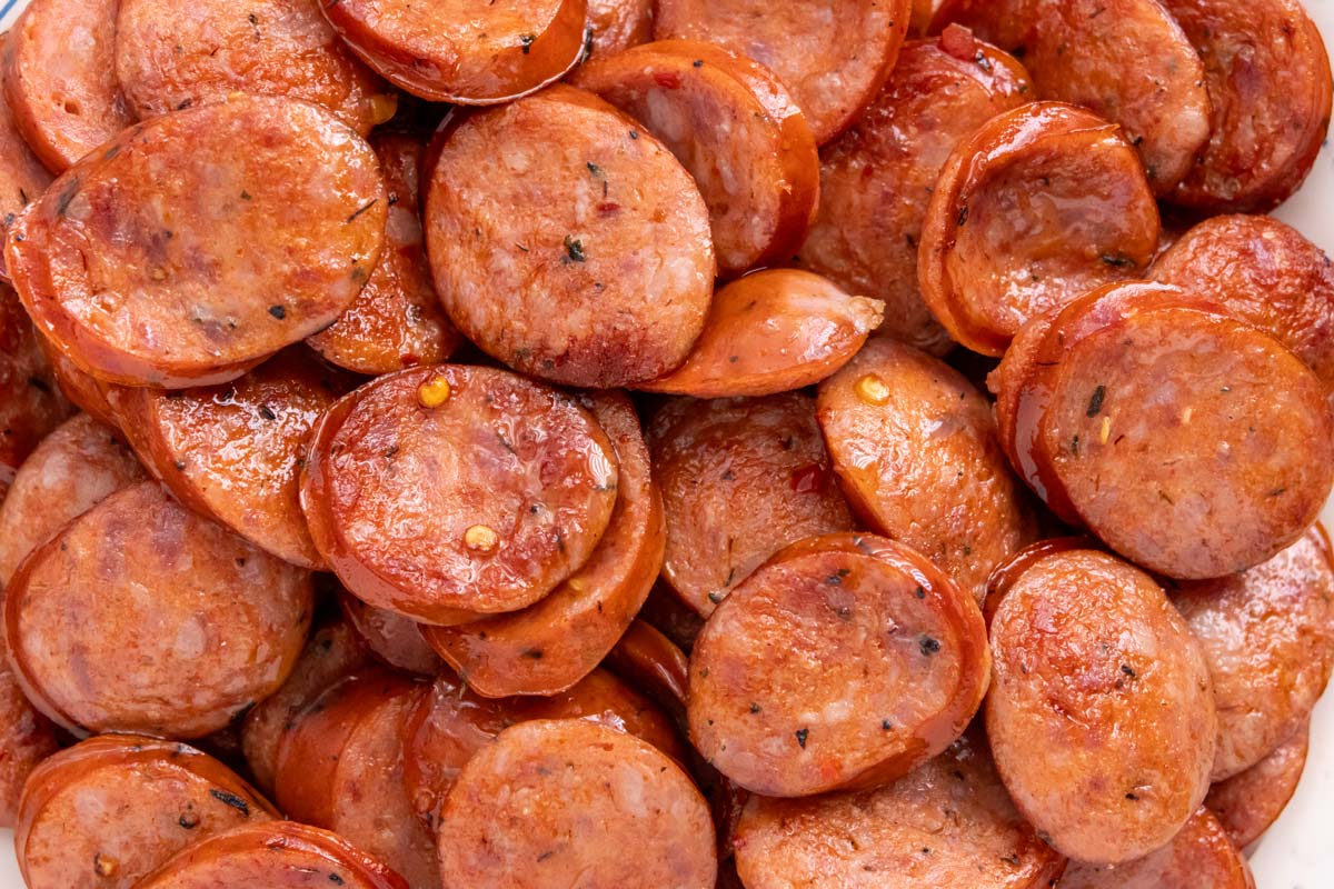 A pile of sliced and seared andouille sausage.
