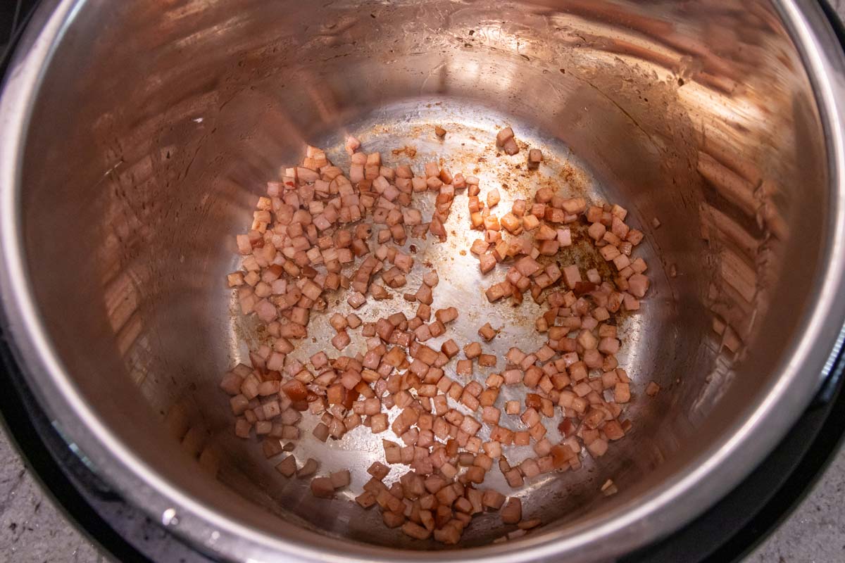 Finely diced ham lightly browned in an Instant Pot.