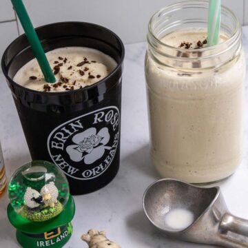 Two cups of frozen Irish coffee and an Irish snow globe.