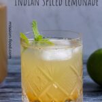 Shikanji Indian lemonade in a crystal glass a mint garnish.