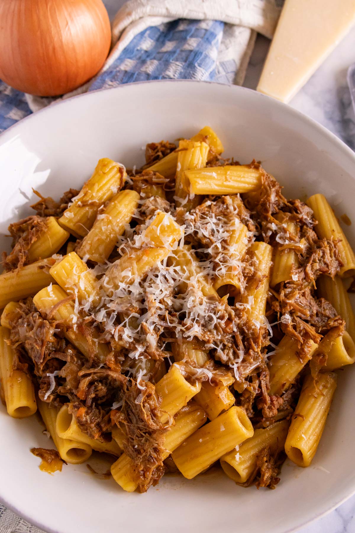 Rigatoni with Genovese braised beef and onion sauce, topped with Parmigiano-Reggiano cheese.