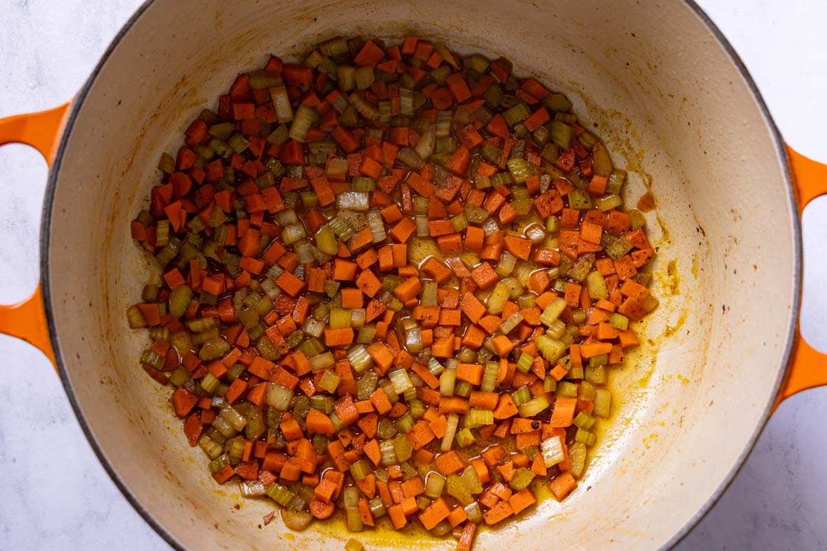 White wine reduced with sauteed diced carrots and celery in a Dutch oven.