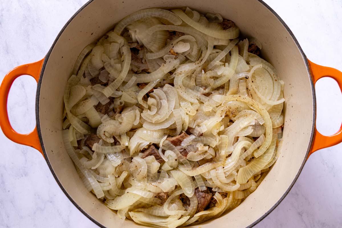 Sliced onions softened and sweated down in a Dutch oven.