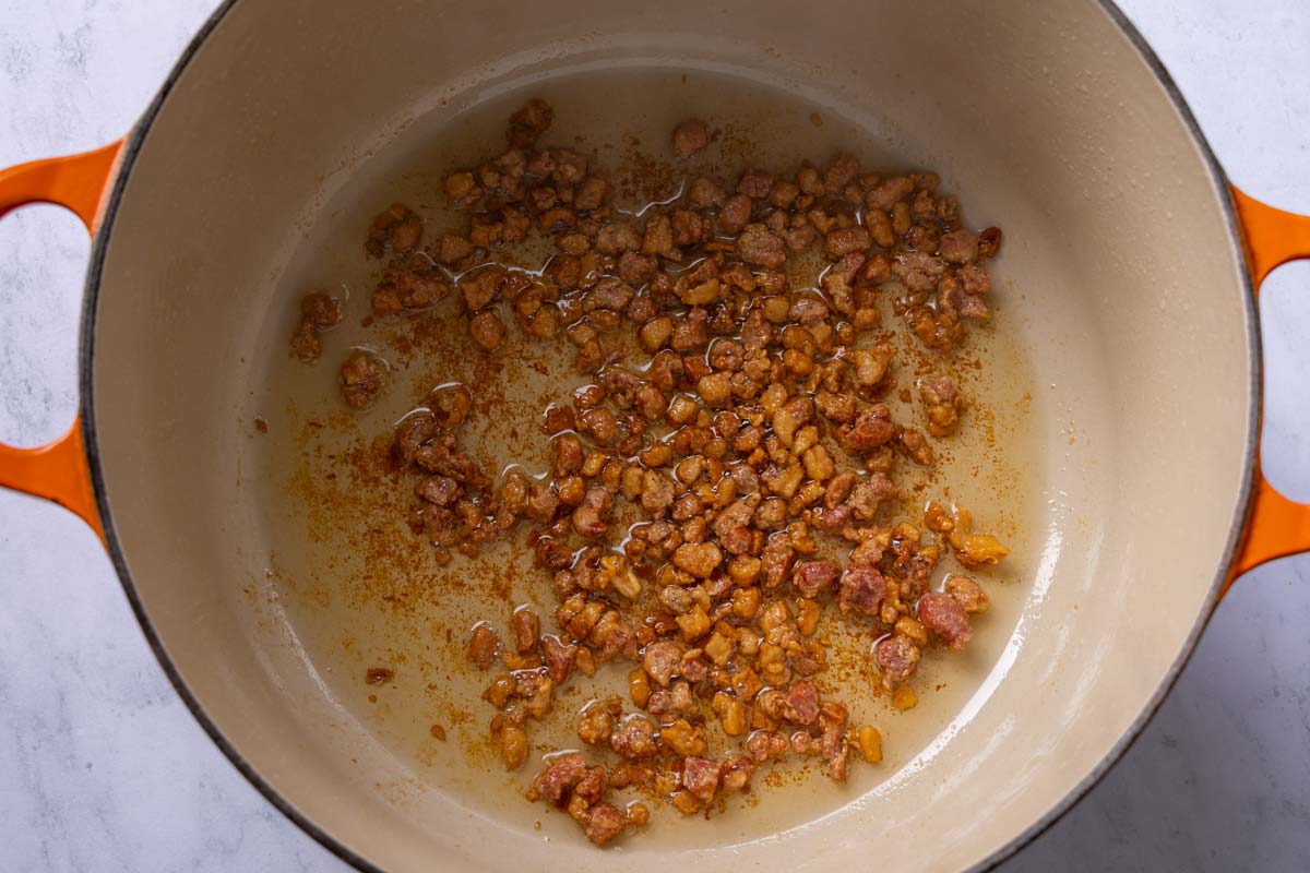 Diced pancetta crisped up and fat rendered in a Dutch oven.