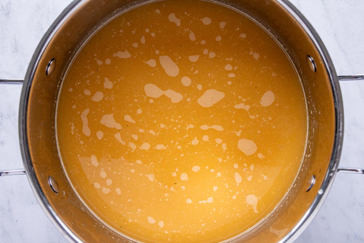 Pureed vegetables added back to a soup pot.