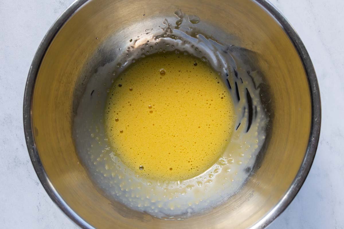 A frothy mixture of beaten egg yolks, lemon juice, and vinegar.