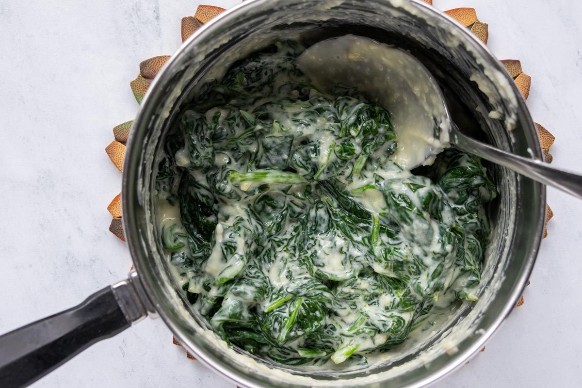 Creamed spinach in a saucepan.