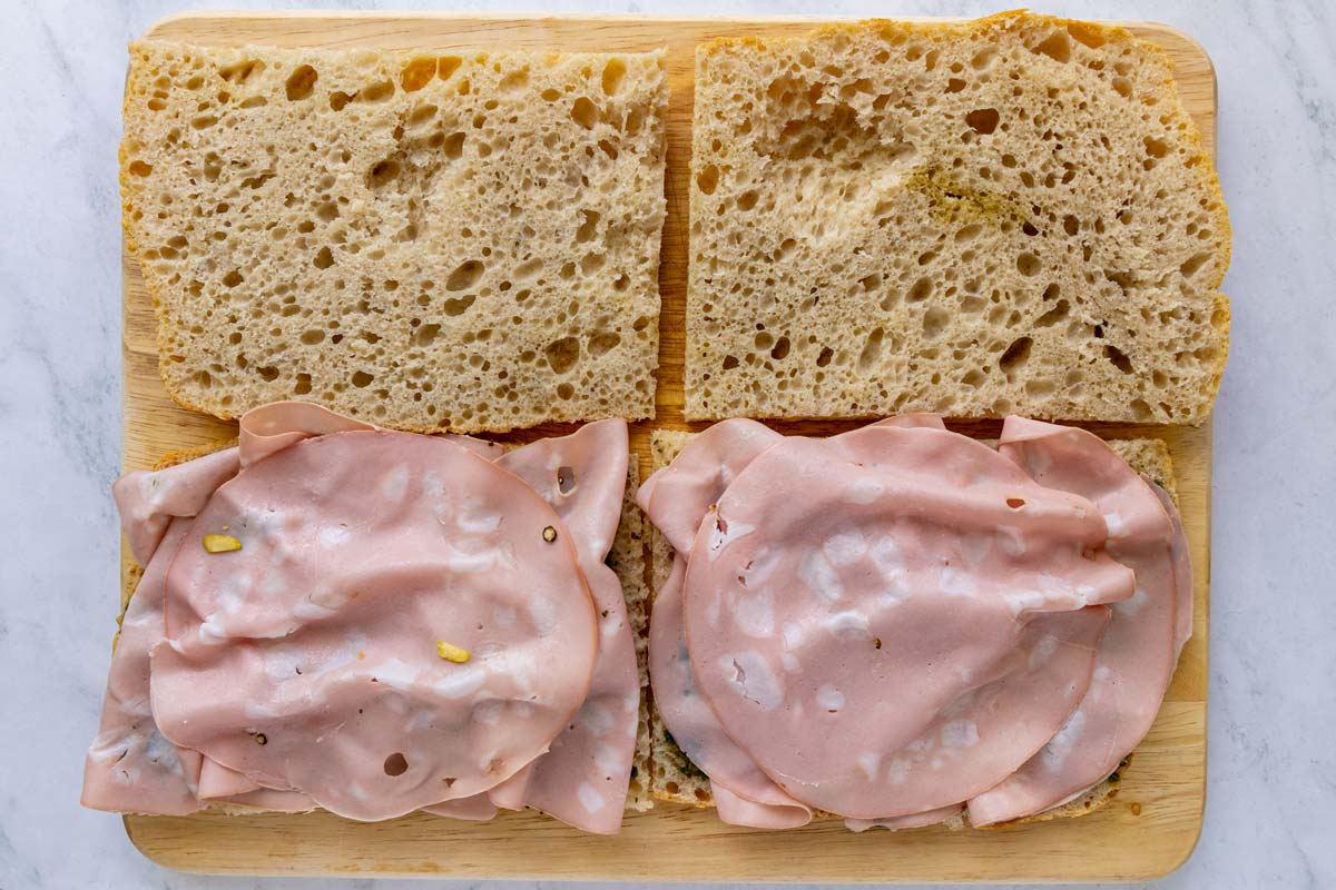 Sliced mortadella added to a couple sandwiches.