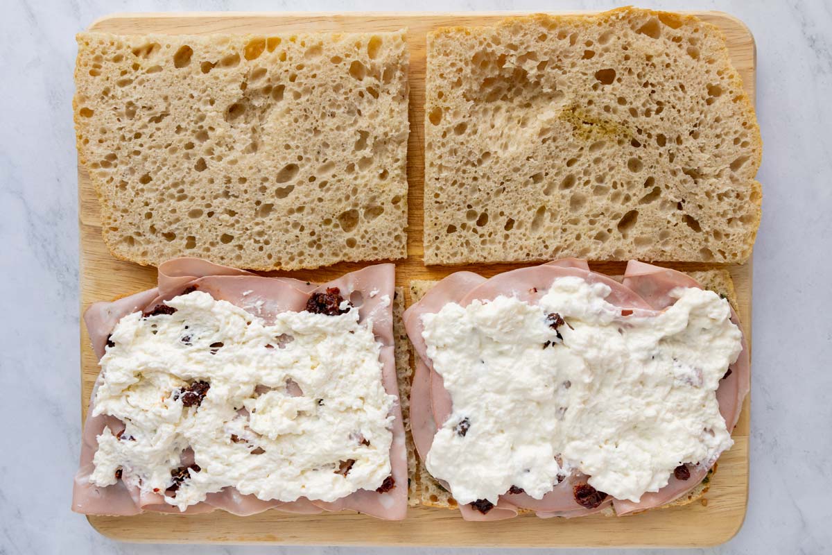 Stracciatella cheese added to a couple mortadella sandwiches.