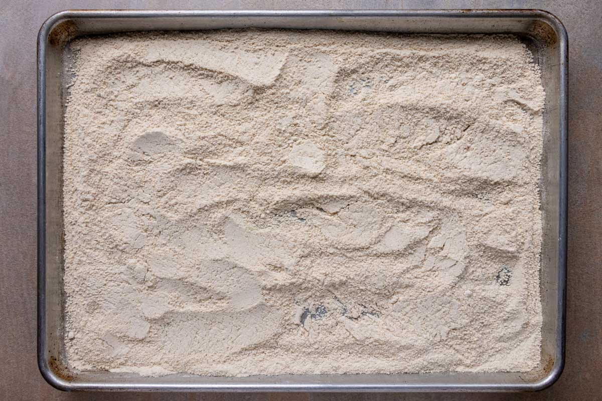 Flour and almond meal toasted on a baking sheet.