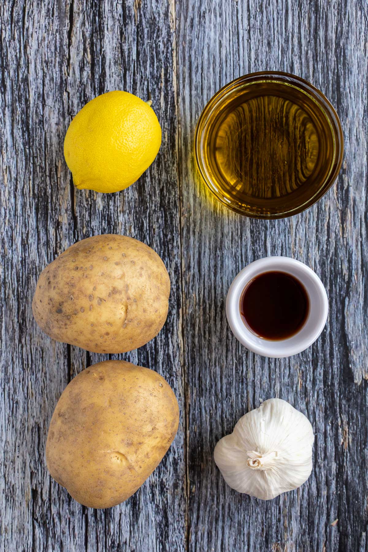 Ingredients for skordalia on a blue wooden background.