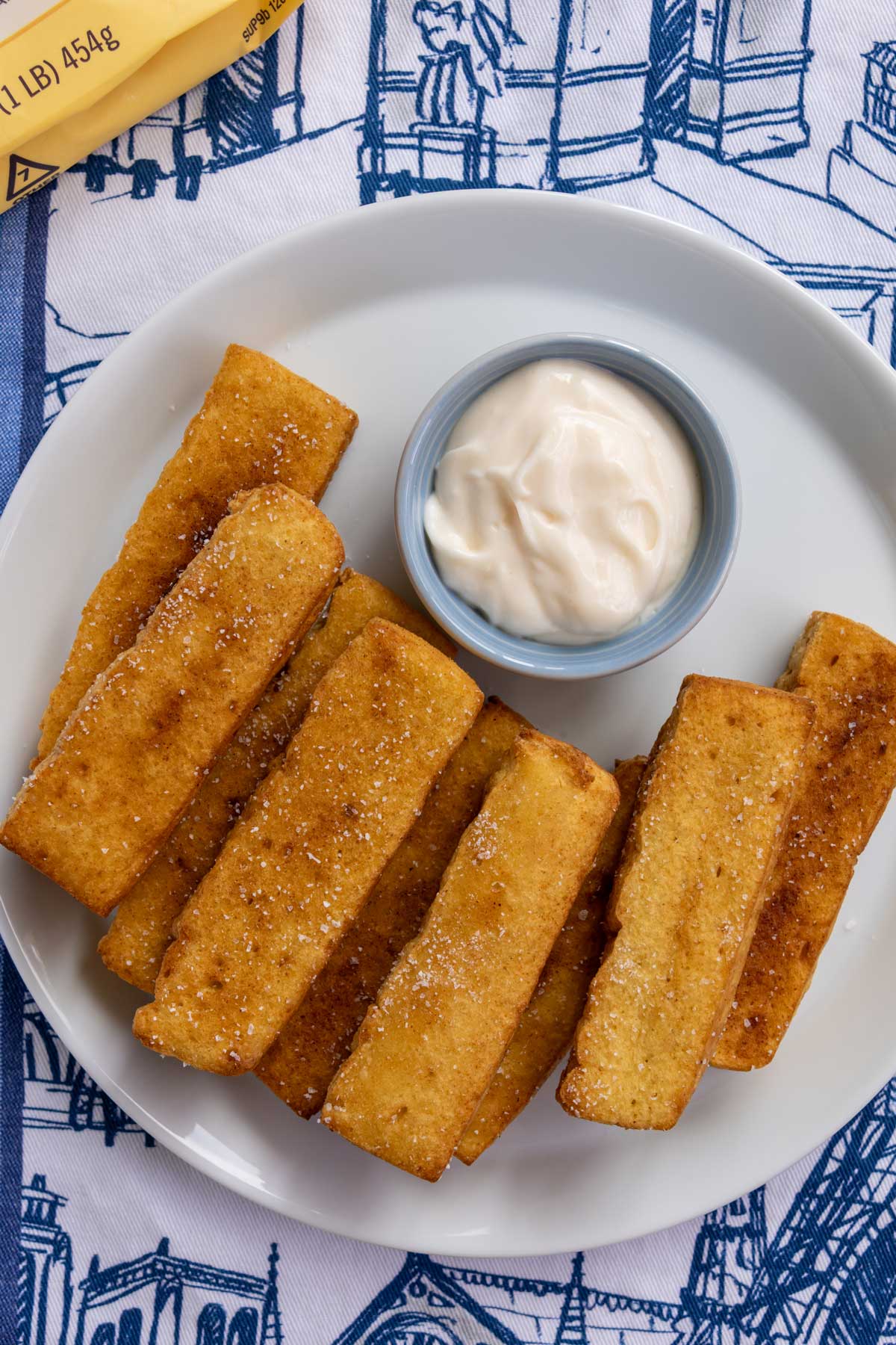 A plate of chickpea fries with a side of aioli for dipping.