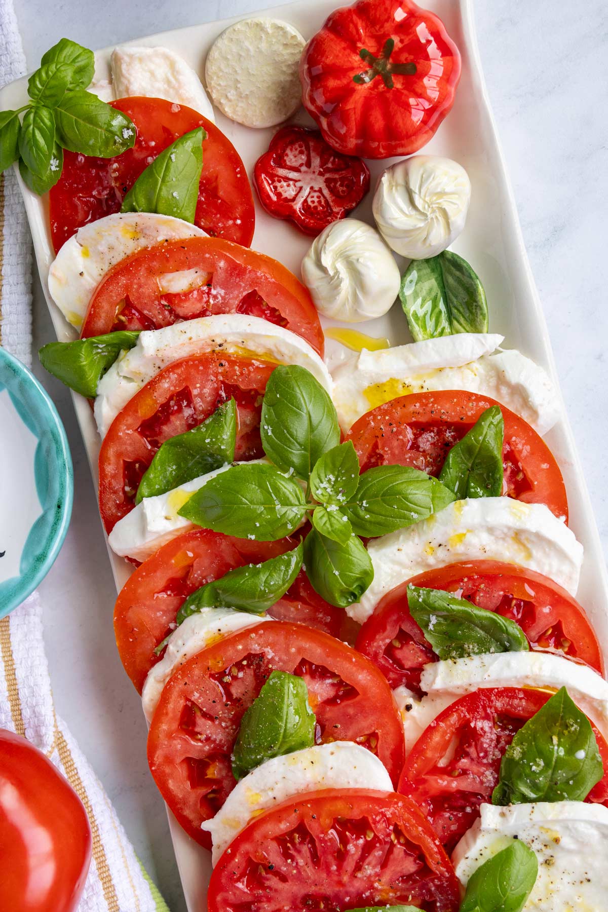 Insalata caprese made with buffalo mozzarella, beefsteak tomatoes, and fresh basil.