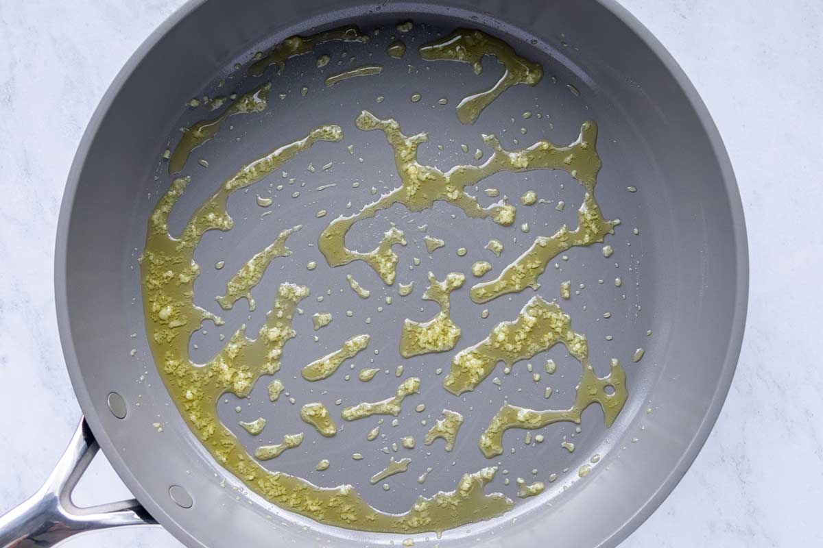 Olive oil and minced garlic in a nonstick skillet.